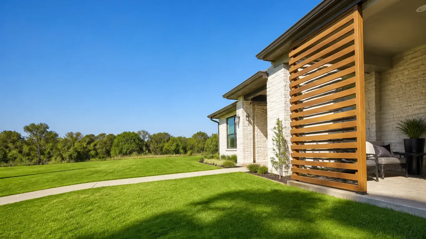 Illustration: Cedar slat privacy screen at the end of a covered porch beside a lawn; Project planning by veteran-owned 214 Veteran Solutions