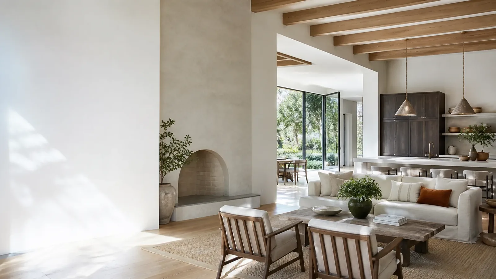 Bright living space with a tall smooth-painted wall, a painted ceiling between wood beams and a plaster fireplace surround